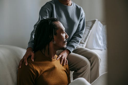 Free African American couple resting in bedroom together Stock Photo