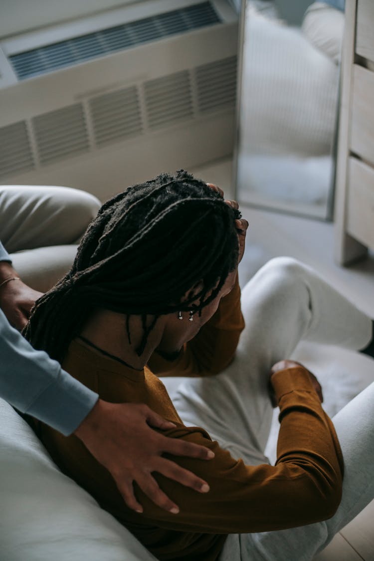 Crop Partner Supporting Sorrowful Black Man At Home