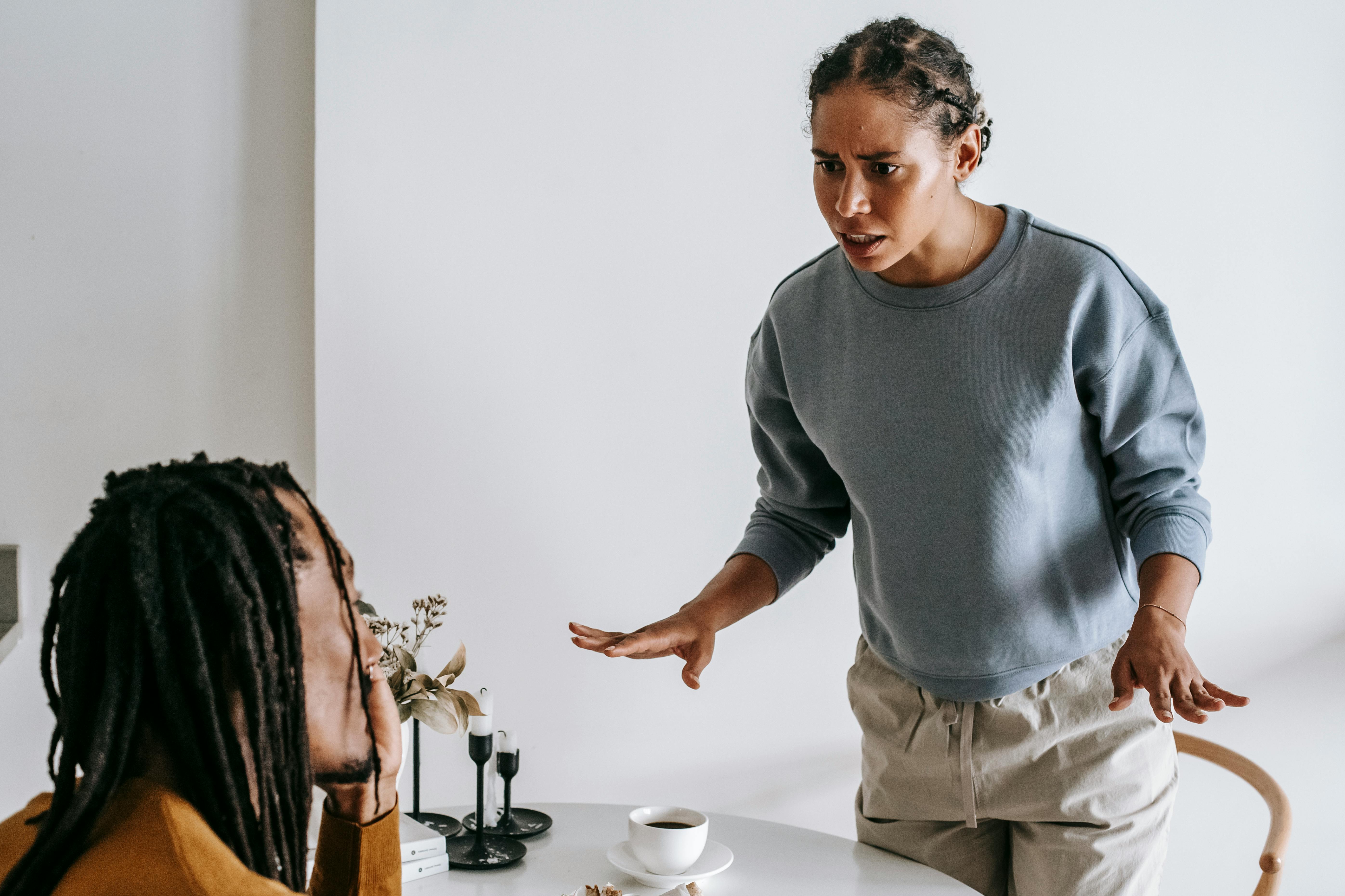 A Woman Sits On The Bed Beside A Face-down Man Coffee Mug by