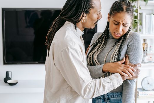 Crop black couple quarreling at home