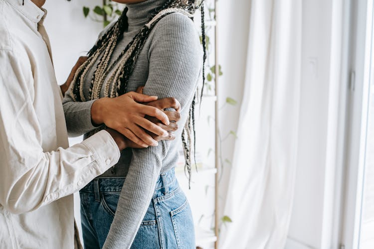 Crop Ethnic Couple Caressing At Home