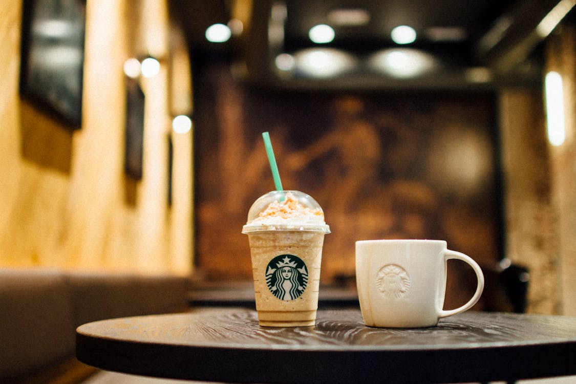 Close-Up Photo of Starbucks Cups