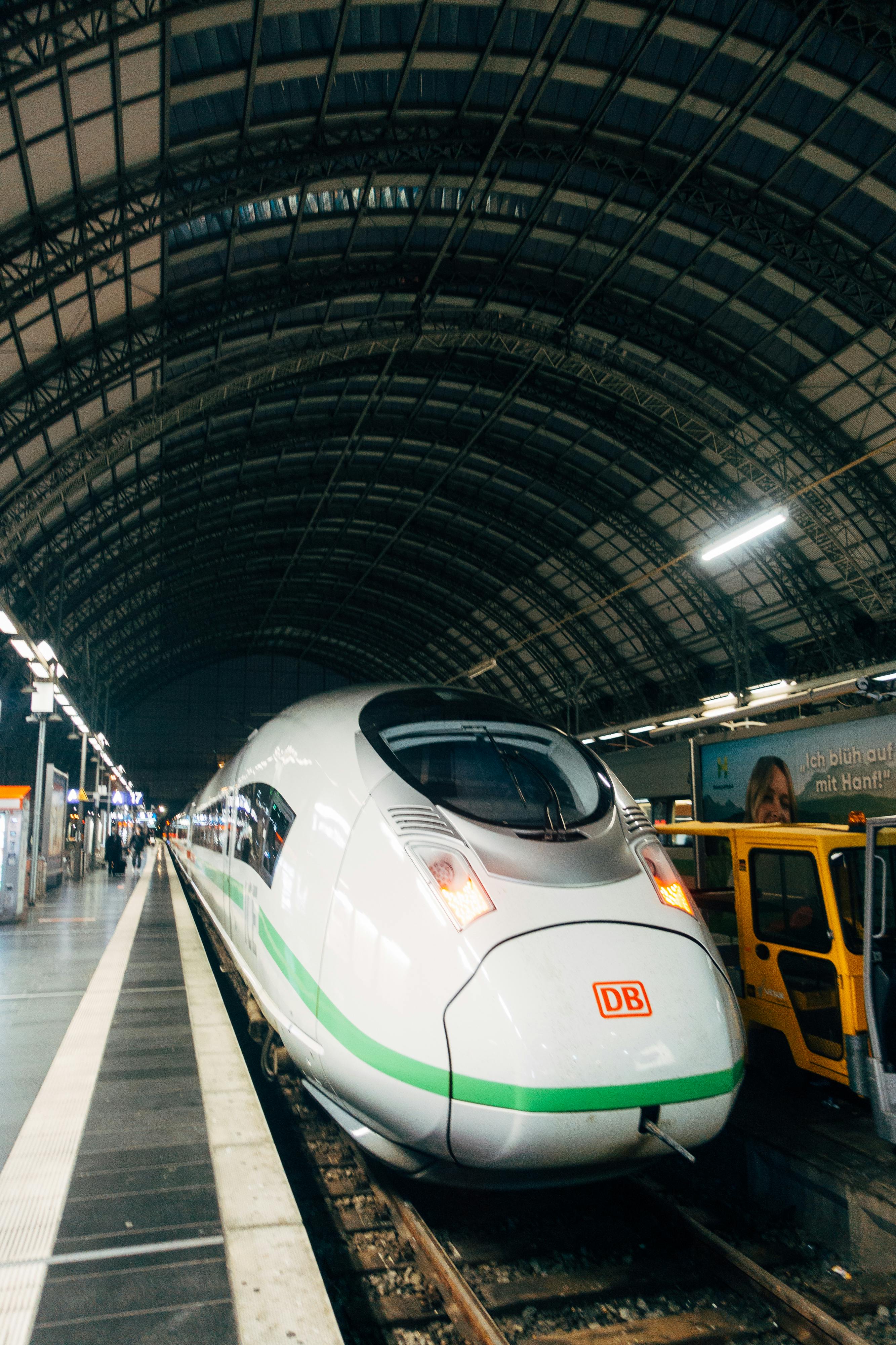 Premium Photo  A silver bullet train is on the tracks