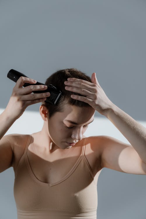 A Woman Shaving Her Head