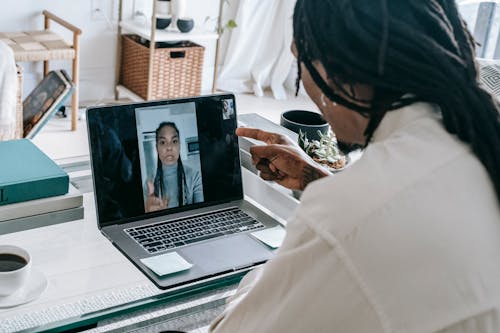 Stressed black couple having video call via laptop