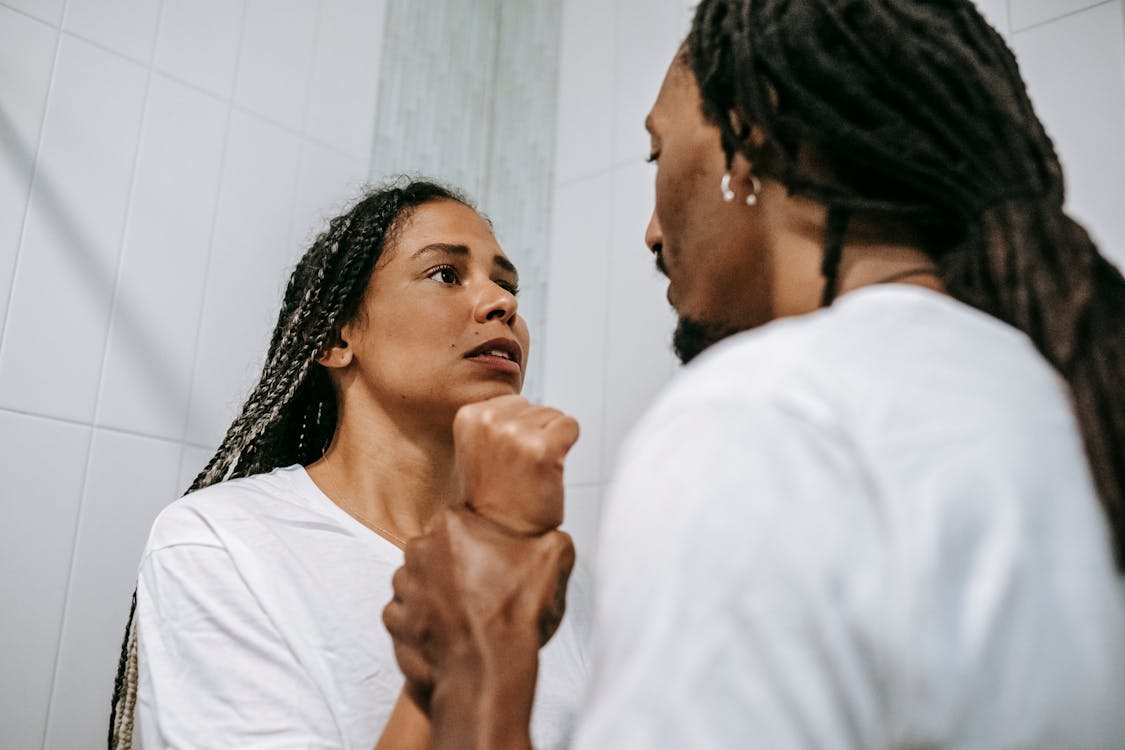 Free Anxious black couple arguing in bathroom Stock Photo