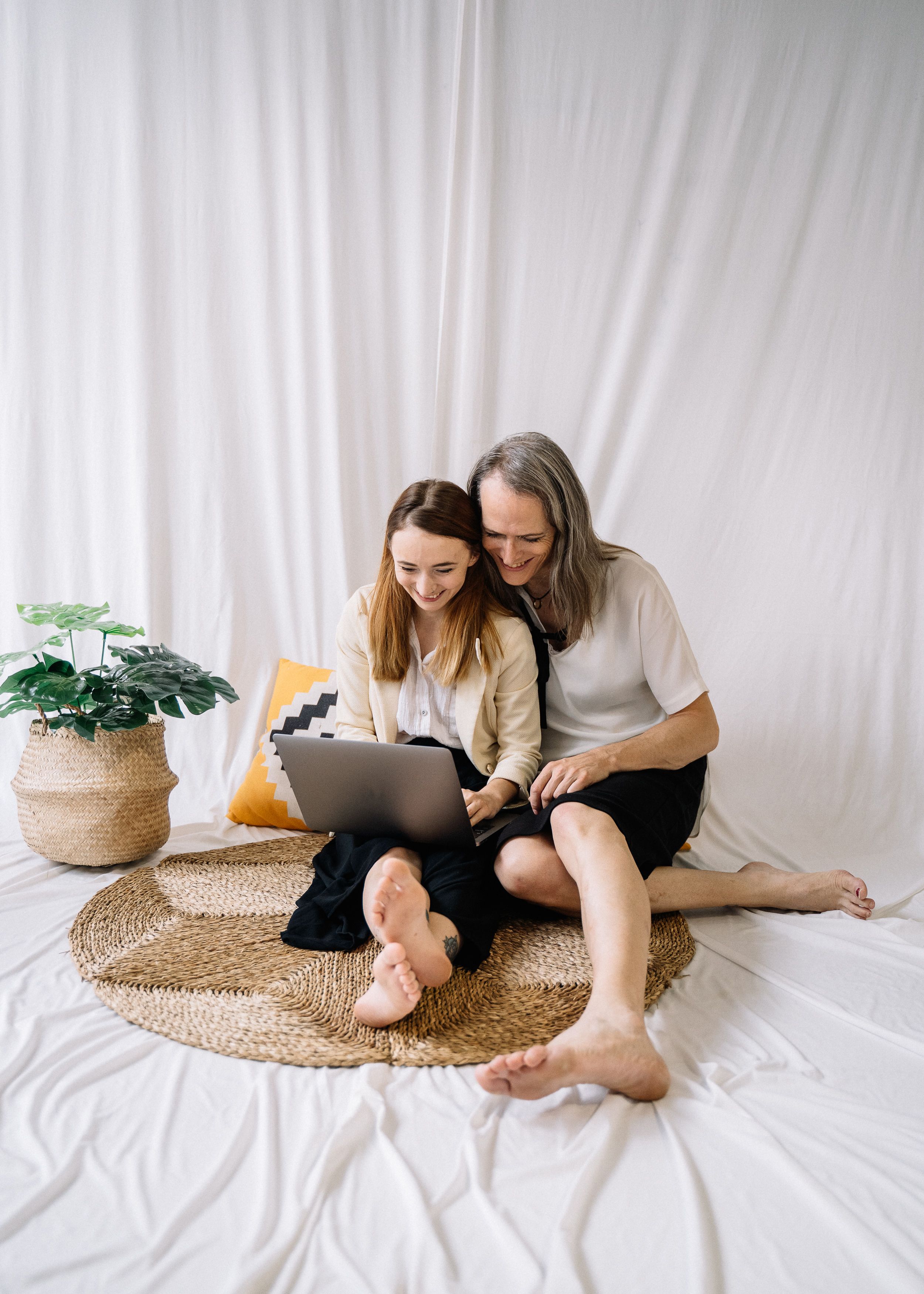 Woman in White Shirt Sitting on Brown Woven Rug · Free Stock Photo