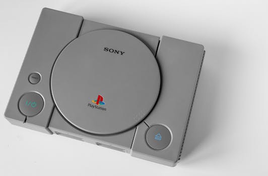 Top view of a vintage PlayStation 1 console on a clean white surface, highlighting its design.