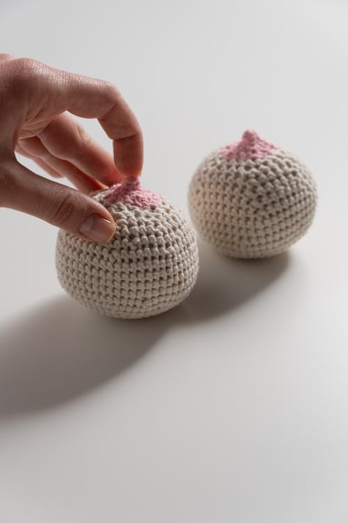 Free White and Gray Egg on Persons Hand Stock Photo
