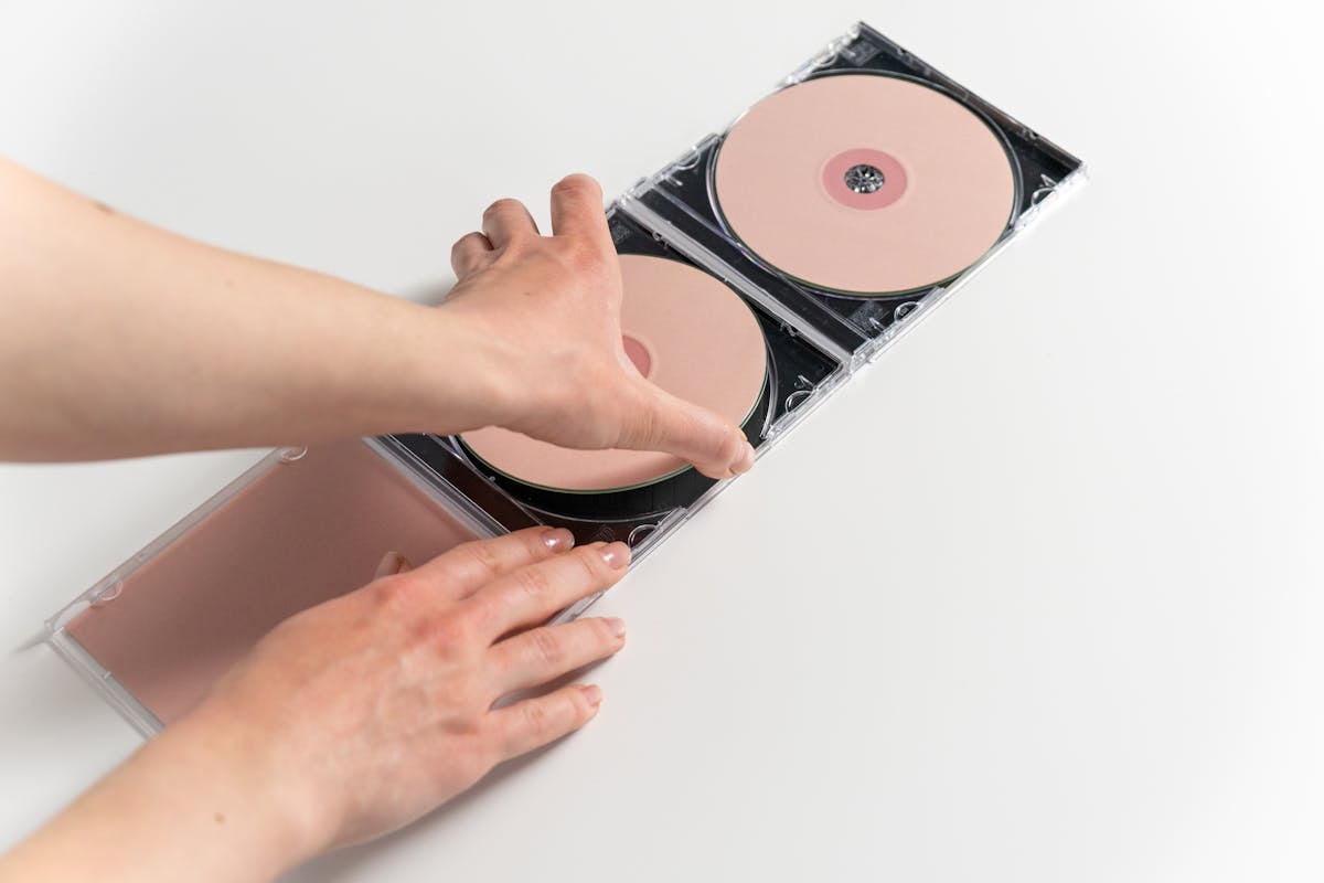 A Person Holding a CD