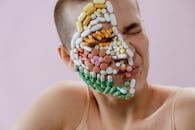 Assorted Medicines on Woman's Face