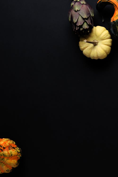 Flatlay Photography of Pumpkins on Black Background