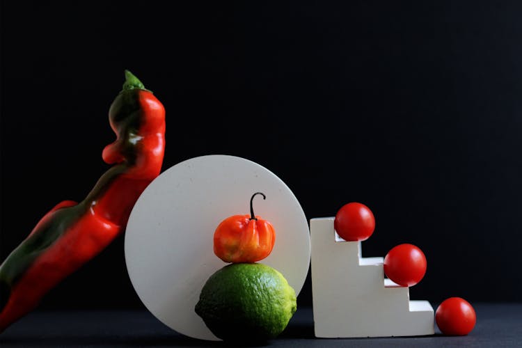 Creative Art With Red Vegetables And Lime 