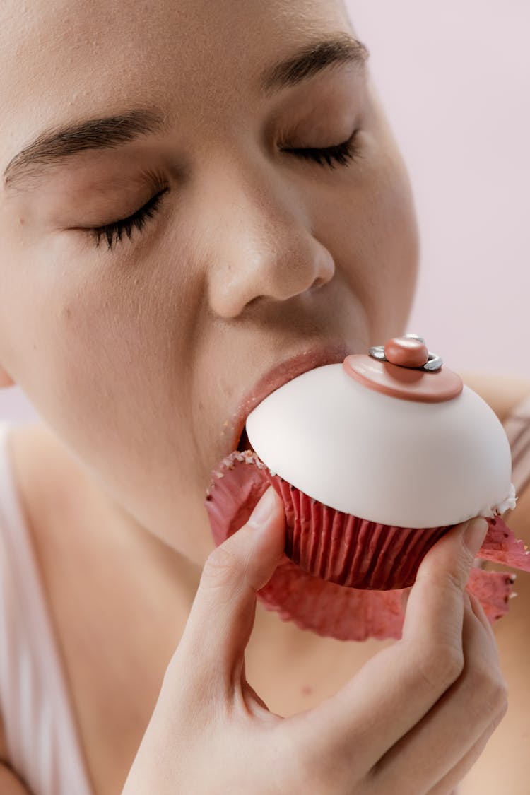 Woman Eating A Customized Cupcake