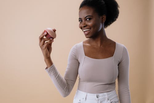 A Woman Holding a Conceptual Toy