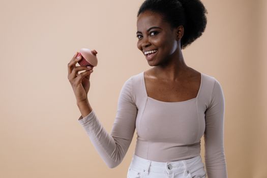 A Woman Holding a Conceptual Toy