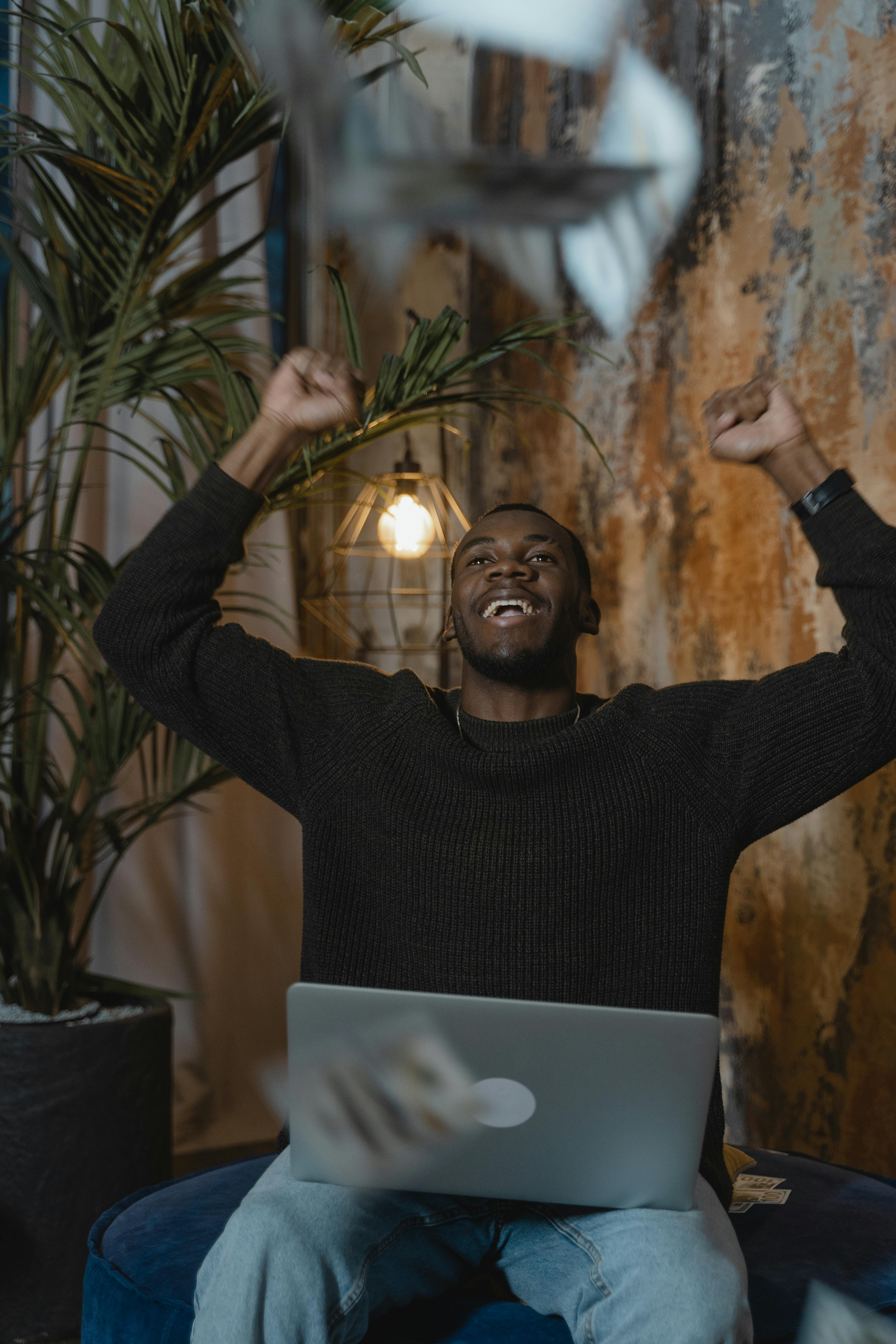 man in black long sleeve shirt throwing cards in the air