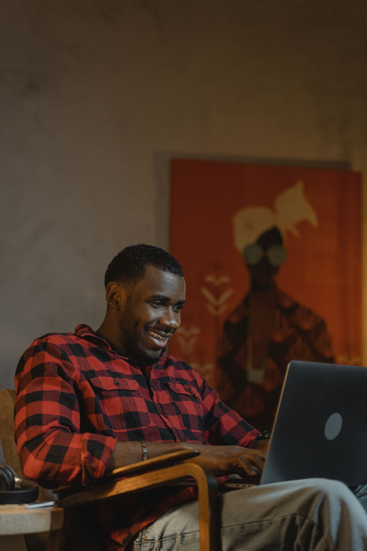 A man working on a laptop from home