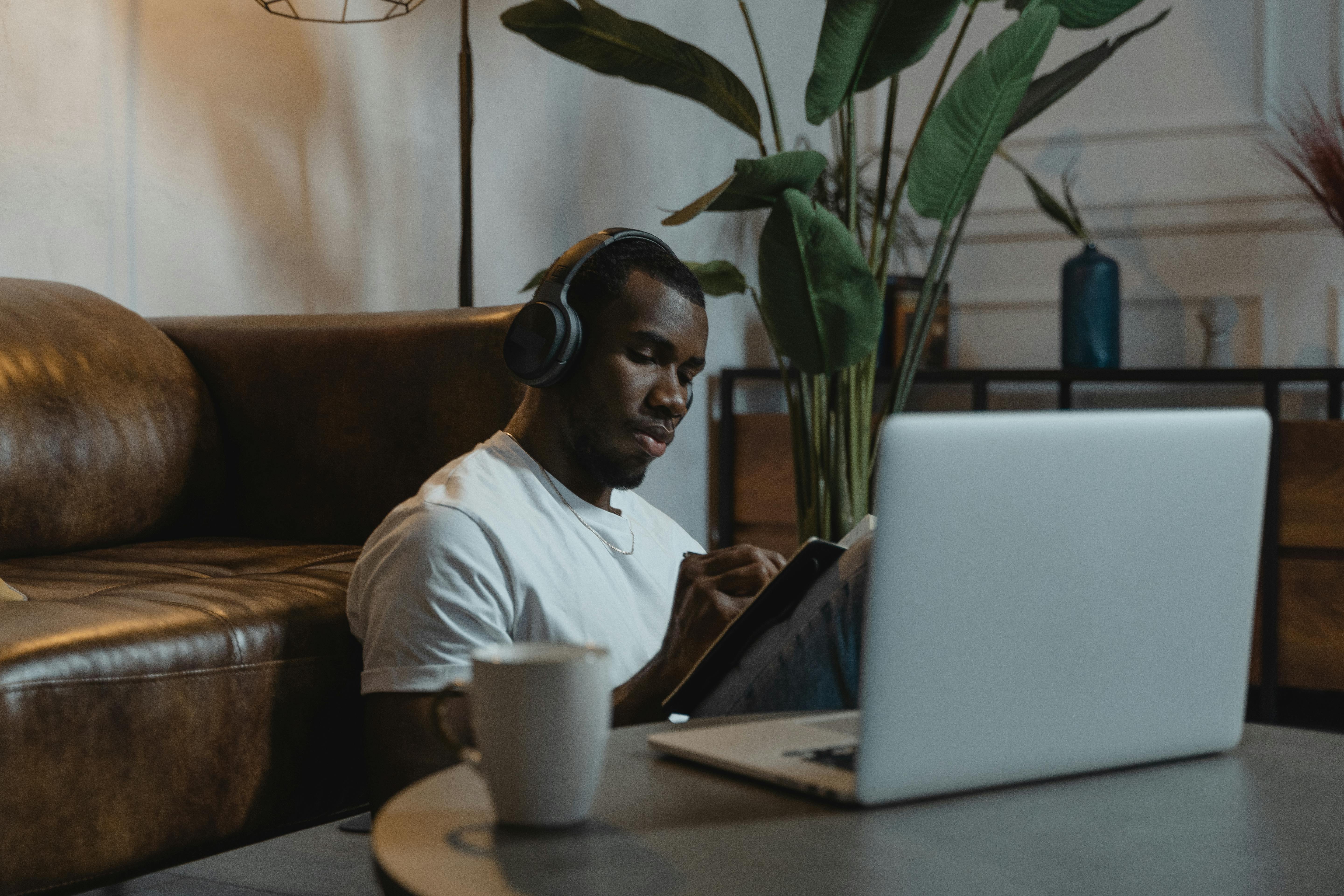 man having his online class in living room