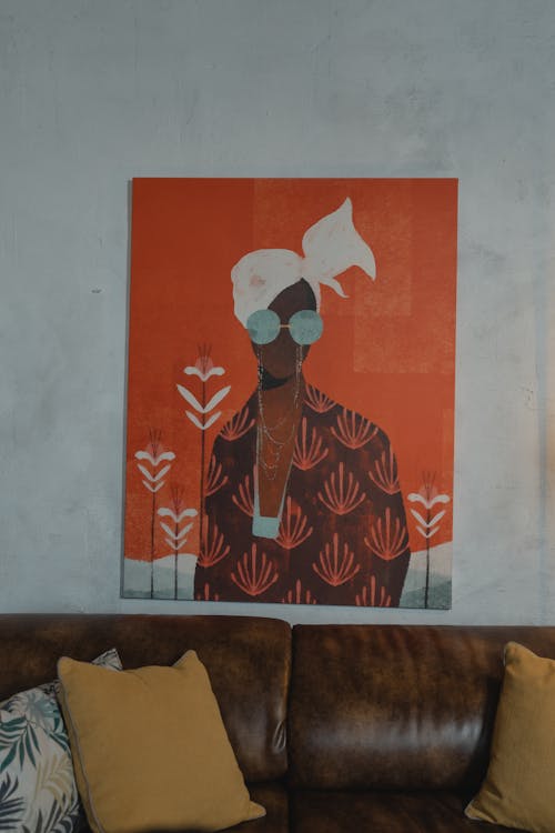 A Painting Hanging on the Wall near the Brown Sofa