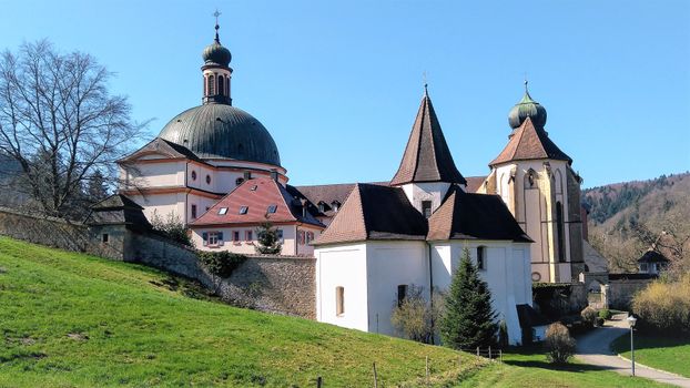 Beautiful church with unique architecture set in a picturesque countryside landscape.