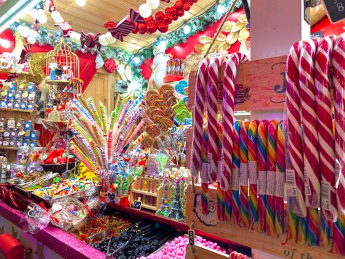 Free Vibrant candy display in a Paris shop with assorted sweets and holiday decorations. Stock Photo