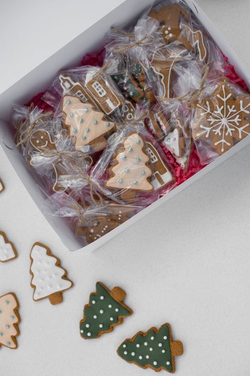 Free Gingerbread cookies in a festive box ideal for Christmas celebrations. Stock Photo