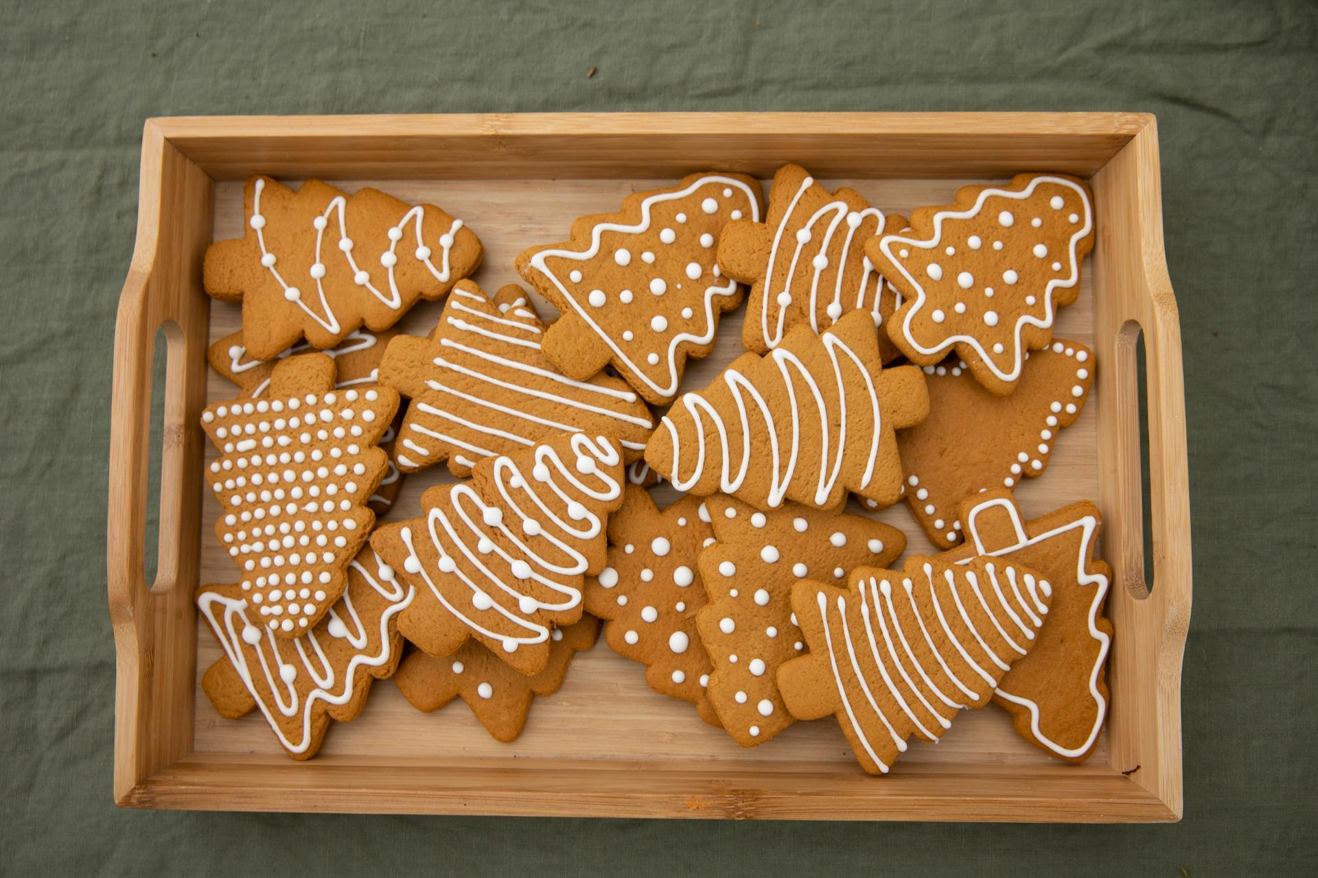 Brown Christmas Tree-Shaped Gingerbread Cookies in a Wooden Crate