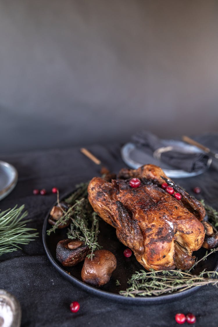 Roasted Turkey On Black Round Plate