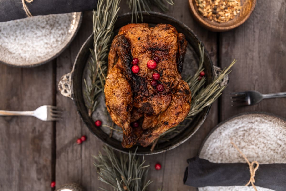 Thanksgiving slow cooker recipes: crockpot turkey breast garnished with cranberries