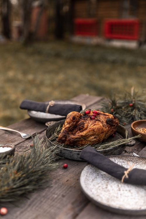 Free Cozy Thanksgiving outdoor setup with roasted turkey and festive decor. Stock Photo