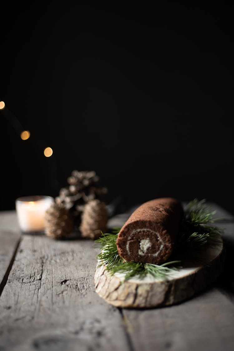 Chocolate Cake Roll On Wooden Table