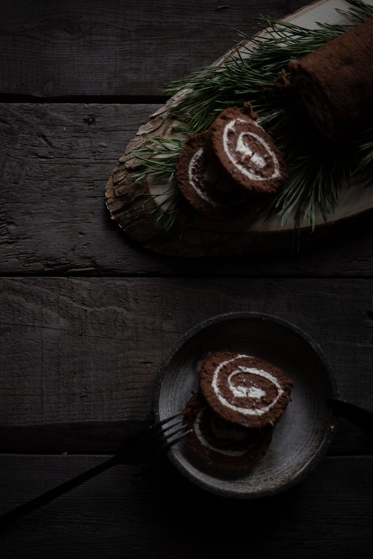 Cake Rolls On Wooden Plank