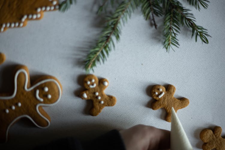 Gingerbread Man Near Pine Leaves