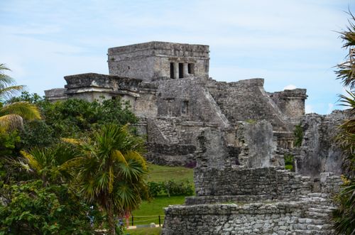Free Explore the ancient Mayan ruins of Tulum near Cancún, surrounded by lush greenery and historic structures. Stock Photo