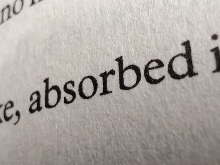 Close-up Of Words Printed On Book Page