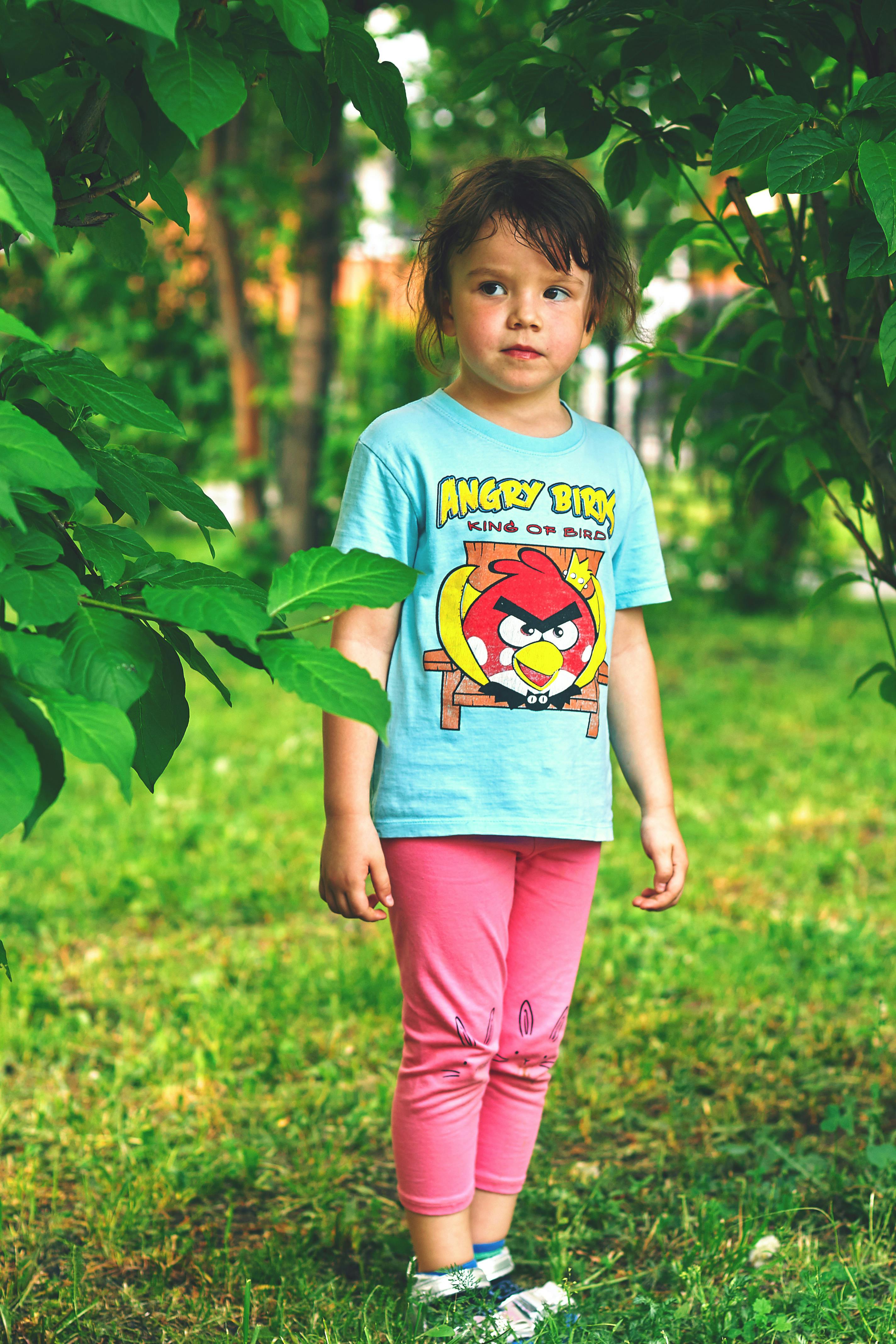 Photo of a Girl Wearing a Blue Shirt and Pink Pants · Free Stock Photo