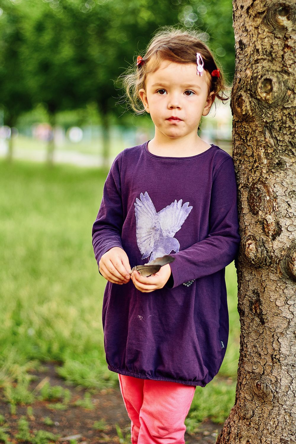 A Girl in Purple Long Sleeve Dress Standing Beside Tree · Free Stock Photo