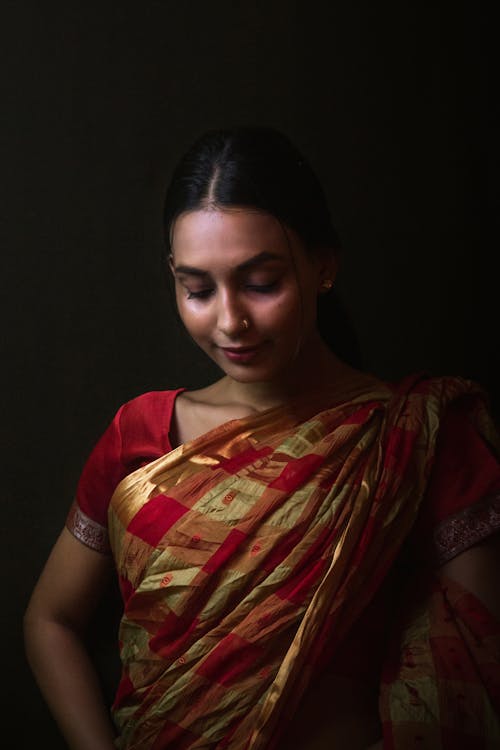 Woman in Red and Yellow Sari