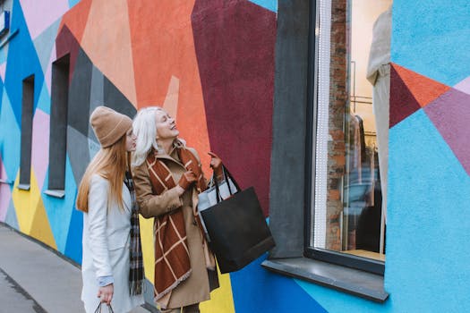 A grandmother and teenager enjoy window shopping against a colorful urban backdrop.