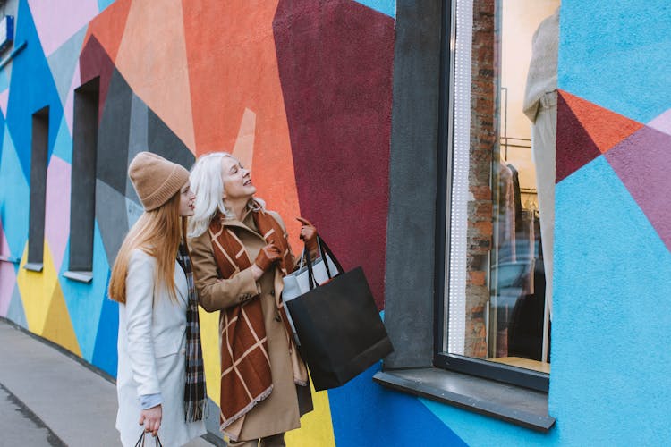  Grandmother And Teenage Girl Looking At The Show Window