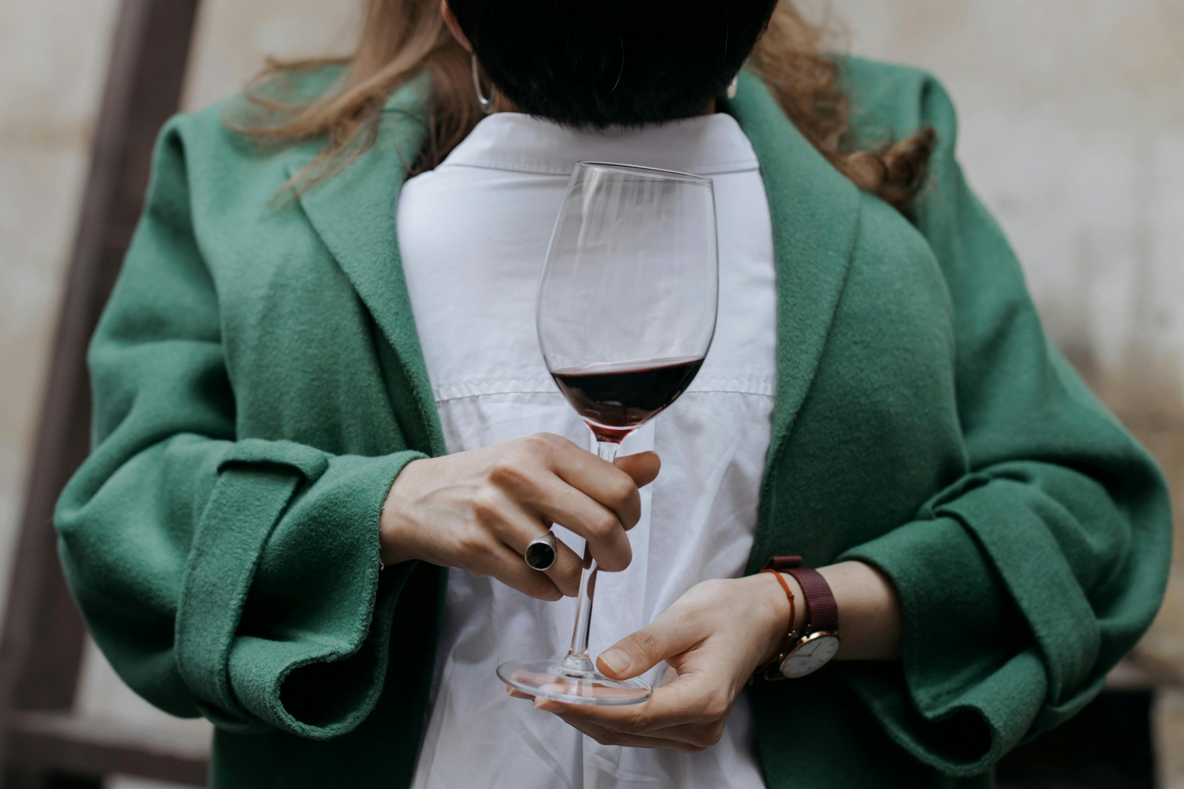 A person holding a sophisticated piece of clothing