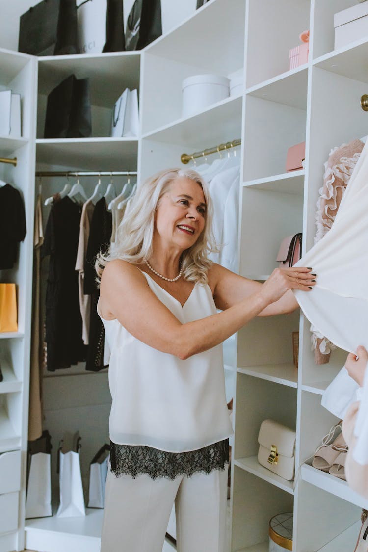 Elderly Woman In Her Walk-in Closet