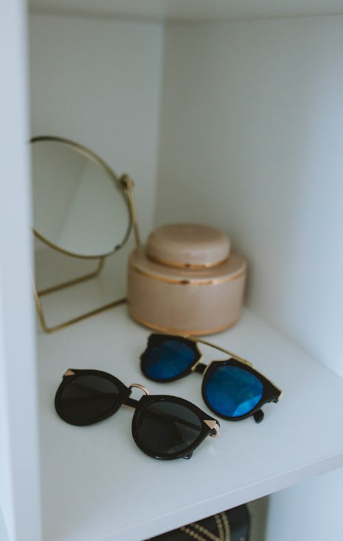 Free  Sunglasses on the White Shelf Stock Photo