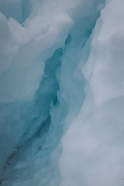 Free Close-up view of a glacier's icy surface in Los Quenes, Chile, showcasing natural blue hues. Stock Photo