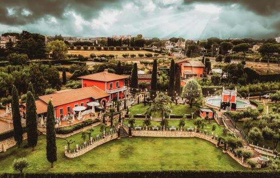 Stunning aerial view of a vibrant estate in Rome with lush gardens.