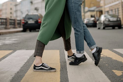 Person in Green Pants and Black and White Nike Sneakers