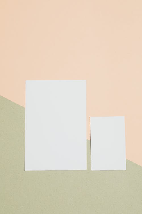 White Papers on Beige and Olive Background