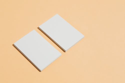 Free White Paper on Brown Table Stock Photo