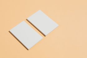 Notebook and type samples on a light surface — kaboompics on Pexels